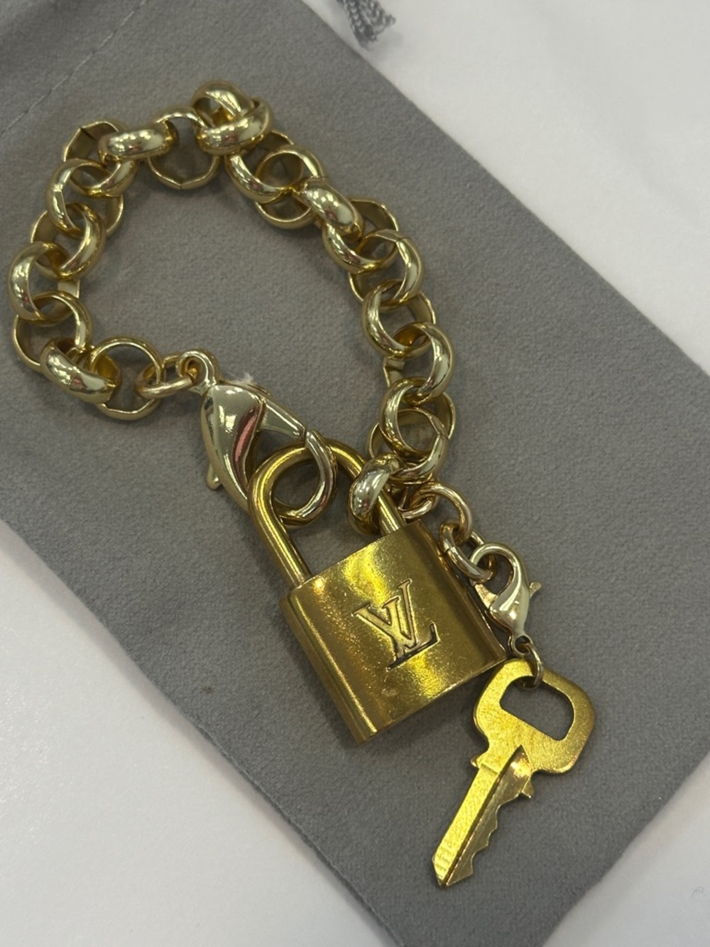 Repurposed authentic Louis Vuitton locket bracelet. Gold Rolo chain link
